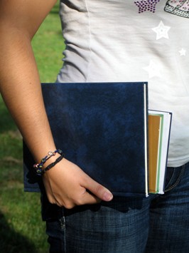 Back on campus - high school or college - and headed to class.  The amount of textbooks under the arm will increase as the semester progresses.  Photo by Sanja Gjenero of Zagreb, Croatia.